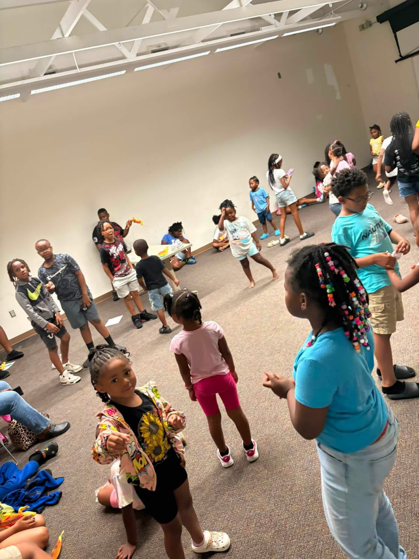 Children playing and dancing together in the activity room