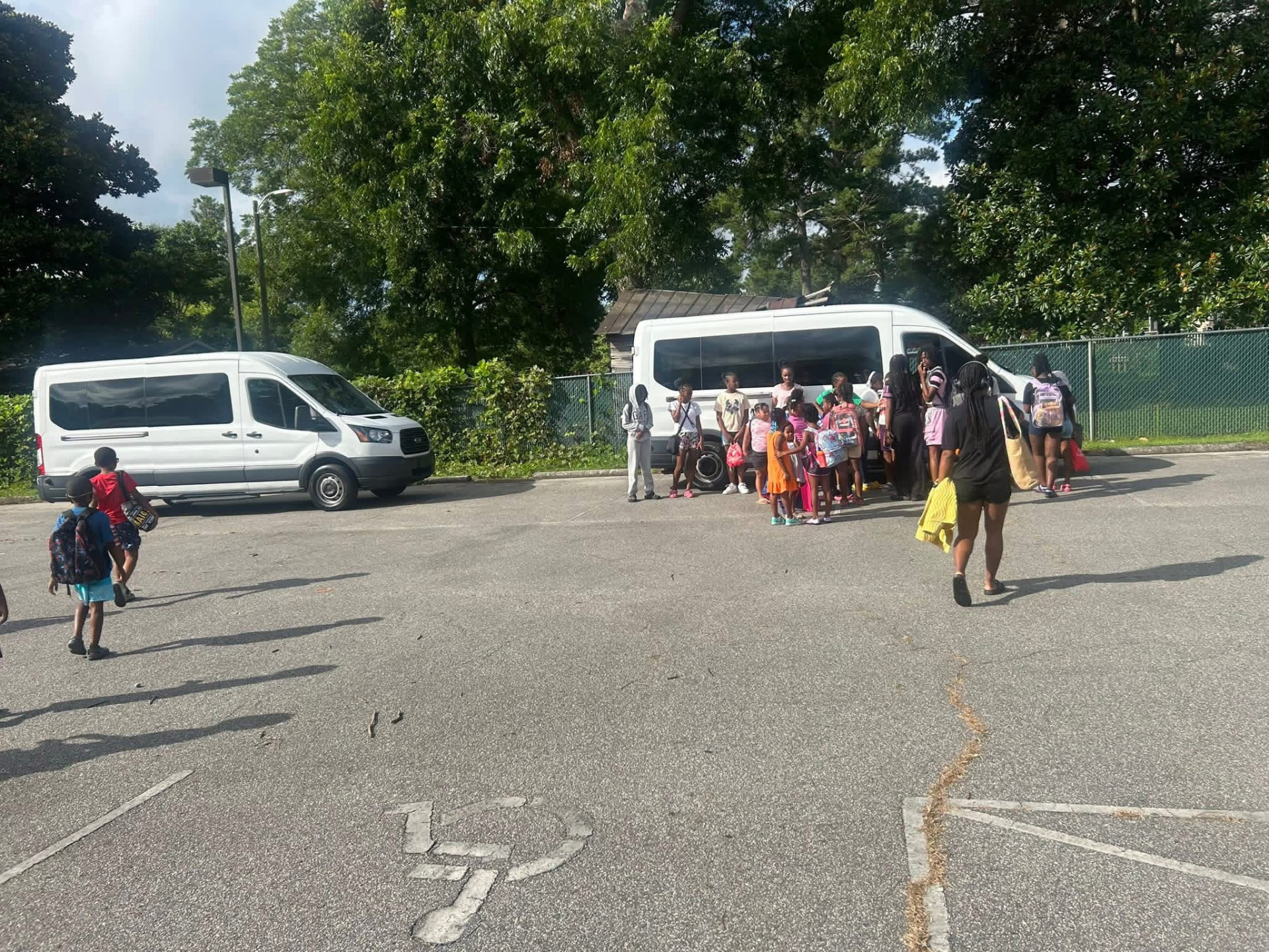 Campers loading vans for a field trip